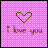 Pixelated pink checkered background with a green pixel-art heart above the text "i love you" in brown and purple pixels.