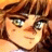 A 48x48 pixel animated buddy icon featuring a close-up of an anime-style character with brown hair and green eyes on the left, paired with text reading "Anime IM" and "COM" on a black background to the right.