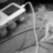 Black-and-white pixelated background with pink text overlay reading "express your self 'music'" in three lines.
