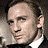Four-frame contact sheet of a man in formal and casual attire with visible text "Casino Royale" on one frame.