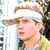 A 4-frame contact sheet of a person wearing visors in various poses and expressions, displayed as an animated buddy icon with visible pixelation.