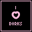 Pixelated pink heart icon with 'DORKS' text below, displayed in two adjacent frames showing slight animation variation on black background.