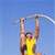 Pixelated static image of a person in mid-air performing a pole vault against a solid blue background, wearing yellow athletic clothing and holding a horizontal pole with both hands above their head.