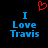 A pixelated image with blue text reading "I Love Travis" on a black background, featuring a red heart symbol above the text.