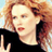 Static 48x48 pixel icon showing a person with light brown curly hair wearing a black top, rendered in low-resolution pixel art style with visible dithering and color blending.