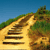 Pixelated landscape with a winding dirt path leading up a grassy hill under a clear blue sky.