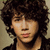 Pixelated image of a person with curly hair, showing two states: one without text overlays and another with 'mms', '+', 'ntj', and 'love.' text elements.