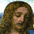 Pixelated close-up of a person with long brown hair against a light blue and white background.