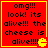 Red background with yellow border and pixelated text reading "omg!!! look! its alive!!! the cheese is alive!!!!!" alongside a Pac-Man icon.