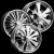 Pixelated grayscale image of three interlocking gear wheels on a black background, with visible mechanical details and varying shades of gray.