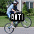 A person riding a bicycle with text overlays changing across frames, set against a suburban background.