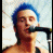 A person with blue hair sings into a microphone, another person wears a blue beanie, and a third has pink hair, all in a four- with 'Puta.' text