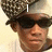 A pixelated image of a person wearing a patterned cap and dark sunglasses with text overlays reading 'I', 'LOVE', and 'KENNON' across different sections.