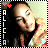 Pixelated image of a person with dark hair wearing a dark top, with colorful text and symbols on the left and bottom-right.