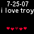 Pixelated text and red heart symbols on black background, with date stamps above each side.