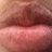A close-up of lips with subtle color variations and texture changes across four