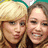 Two women with blonde and brown hair appear in a ; one woman's mouth changes from closed to smiling across frames