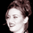 Static 48x48 pixel icon showing a close-up of a person's face with brown hair, rendered in low-resolution grayscale tones against black background.