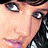 A 48x48 pixel buddy icon featuring a partial close-up of a person's face on the left, with pink text reading "livin in the shadow of some one else dream" arranged across a black background and gray transparency area.