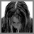 Black-and-white pixelated image of a person with long braided hair bowing their head, with text appearing sequentially across frames.