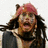 Pixelated image of a person with long dark hair and a pink headband, next to blue background with red text reading 'Go Jack Sparrow!!!'