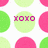 Pixelated circular icon with light green background and magenta text 'XOIO' centered, surrounded by pink and green circular shapes on white background.