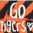 A static image with bold white text reading 'GO TIGERS' against a pixelated orange and dark background.