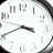 A pixelated clock face on the left side of a light blue background with blue pixelated text on the right.