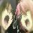 Pixelated static image of a character with light-colored hair and dark clothing, set against a blurred background with green and beige tones.