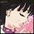 Pixelated close-up of a light-colored animal face with closed eyes, pinkish lower face, and dark background.