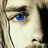 A pixelated image of a person's face with blue eyes and light hair, split into four quadrants with text in red font on beige backgrounds.