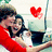 A pixelated image shows two people embracing, one in a red top and the other in dark clothing with long hair, near a laptop displaying a red heart symbol.