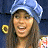 A 48x48 pixel buddy icon featuring a split composition with a person wearing a blue headwrap on the left and "Johnson Family Vacation" text on a green background on the right, displayed as part of an animated contact sheet.