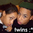 Two individuals in dark clothing with green headwear, one resting their cheek on the other's shoulder, transitioning to a side-by-side pose with text "twins" and a smiley face.