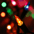 Animated holiday-themed icon with glowing lights and ornaments, transitioning from blurred festive background to clear text "I'll be thinking of you" over gift boxes.