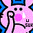 Pixelated pink character with black eyes and mouth, holding a microphone against blue background elements.
