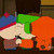 Pixelated character with blue and red striped hat, green neck, white face, brown pants, and orange body parts against dark background.