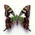 A pixelated butterfly with brown wings featuring green and white patterns, displayed against a plain white background.