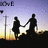Silhouetted couple holding hands walking against a sunset sky with gradient purple to yellow hues, featuring repeated 'LOVE' text in top-left corner.