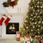 A static image with a red background and pixelated text, featuring a Christmas scene on the left side.