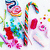 Pixelated candy-themed icon with four quadrants: top-left shows colorful lollipops and a striped cane, top-right displays text on green background, bottom-left has text on pink background, bottom-right is solid gray.