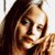 Pixelated close-up of a person's face with long dark hair, visible in a static 50x50 icon format.