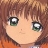 Pixelated close-up of a character's face with brown hair, green eyes, and an orange garment visible at the bottom edge.