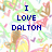 Pixelated image with blue text reading "I LOVE DALTON SO U CAN'T HAVE HIM :-(" over a colorful abstract background of green, pink, yellow, and brown shapes.