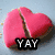 A pink heart-shaped object with a vertical crack, a chocolate chip cookie, and text overlays reading 'YAY', 'NNOO', and 'YAYAAYY' across four