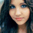 Pixelated image of a person with long dark hair and blue eyes, overlaid with white text reading "Jenny's Amanda's #1 FAN" on the right side.