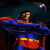 Superman in blue and red costume with yellow belt stands with arms crossed against dark background, transitioning from static pose to motion blur effect.