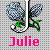 Pixelated icon with two blue-purple flowers on green stems, a white vertical line dividing them, and pink text reading "Julie" below.