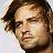 A 48x48 pixel buddy icon featuring a split composition with a portrait of Josh Holloway on the top-left, "Josh Holloway" text on the top-right, and "LOST" text on the bottom-left against a gray background.