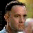A pixelated image of a man's face next to text reading "stupid is as stupid does." on a gradient background.